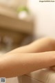 A close up of a woman's legs in a bathtub.